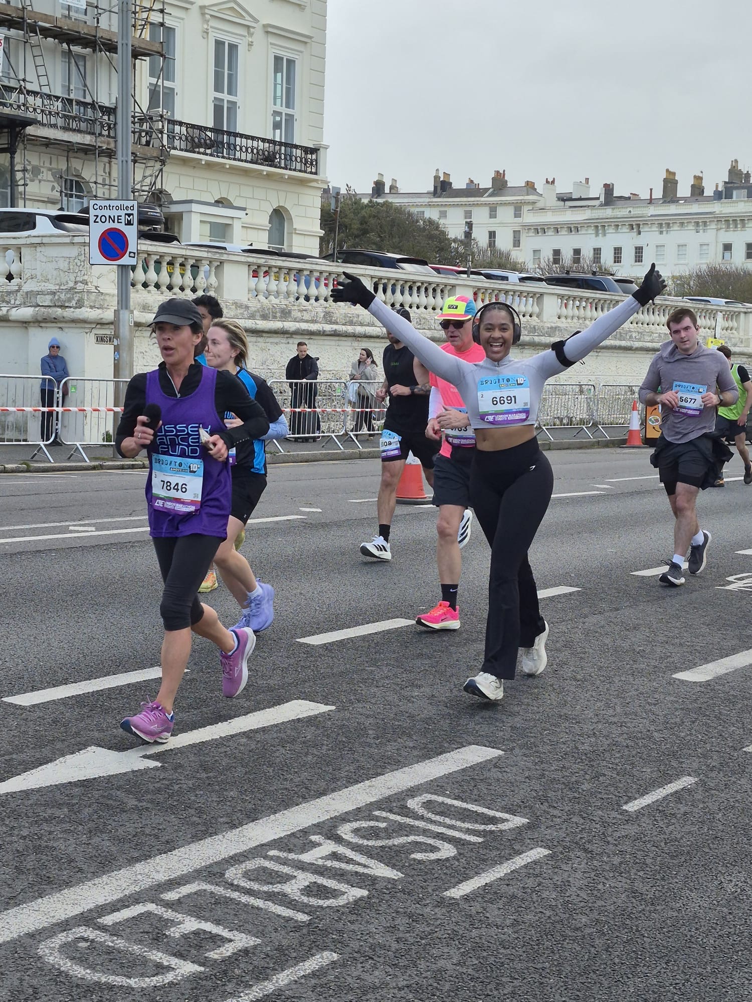 Andrea celebrating mid-race at the Brighton 10K